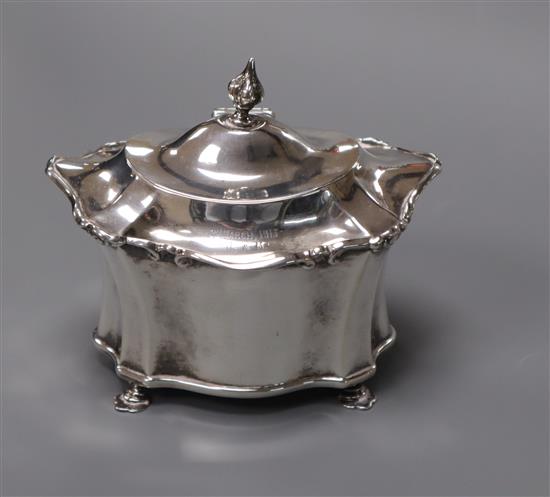 An Edwardian silver shaped oval tea caddy, Chester, 1906, height 10.5cm.